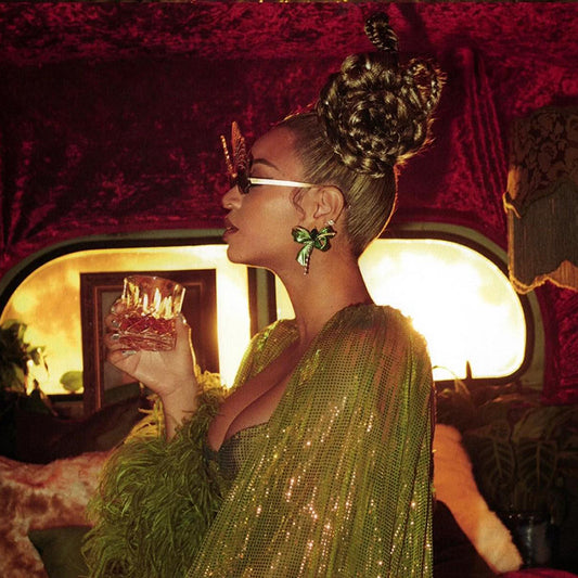 Beyoncé wears the Emerald Cupid's Bow Earrings for the “Cowboy Carter” Vinyl Artwork