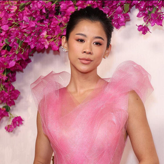 Leah Lewis wears Blush Nova Starburst Ring and Constellation Pearl Ear Cuff to the 96th Annual Academy Awards