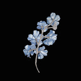 Baby Blue Cherry Blossom Aluminium Brooch, Brooch, Anabela Chan Joaillerie - Fine jewelry with laboratory grown and created gemstones hand-crafted in the United Kingdom. Anabela Chan Joaillerie is the first fine jewellery brand in the world to champion laboratory-grown and created gemstones with high jewellery design, artisanal craftsmanship and a focus on ethical and sustainable innovations.